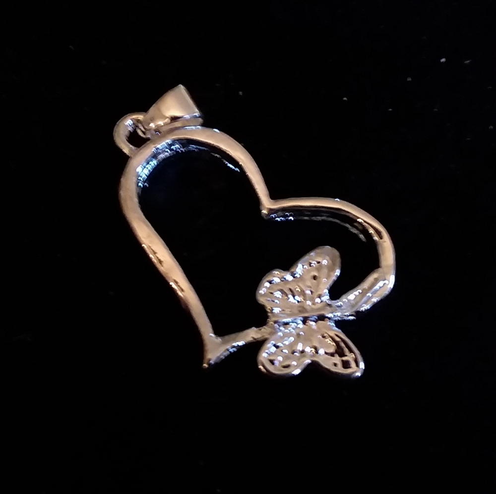 Sterling Silver Butterfly on a Heart Pendant for a Necklace. Stamped 925